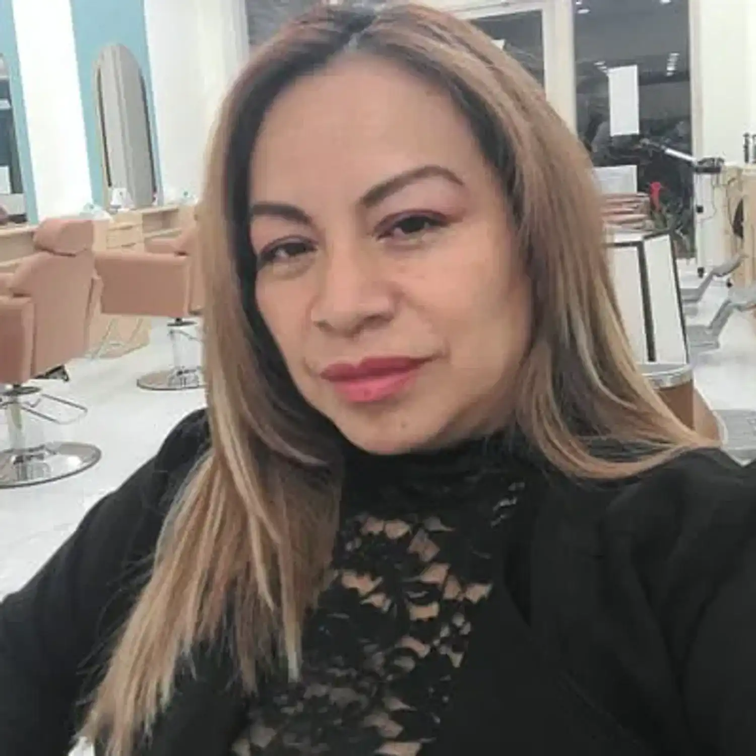 Portrait of Merci, a professional stylist at Royal Hair Salon, showcasing their expertise and style.