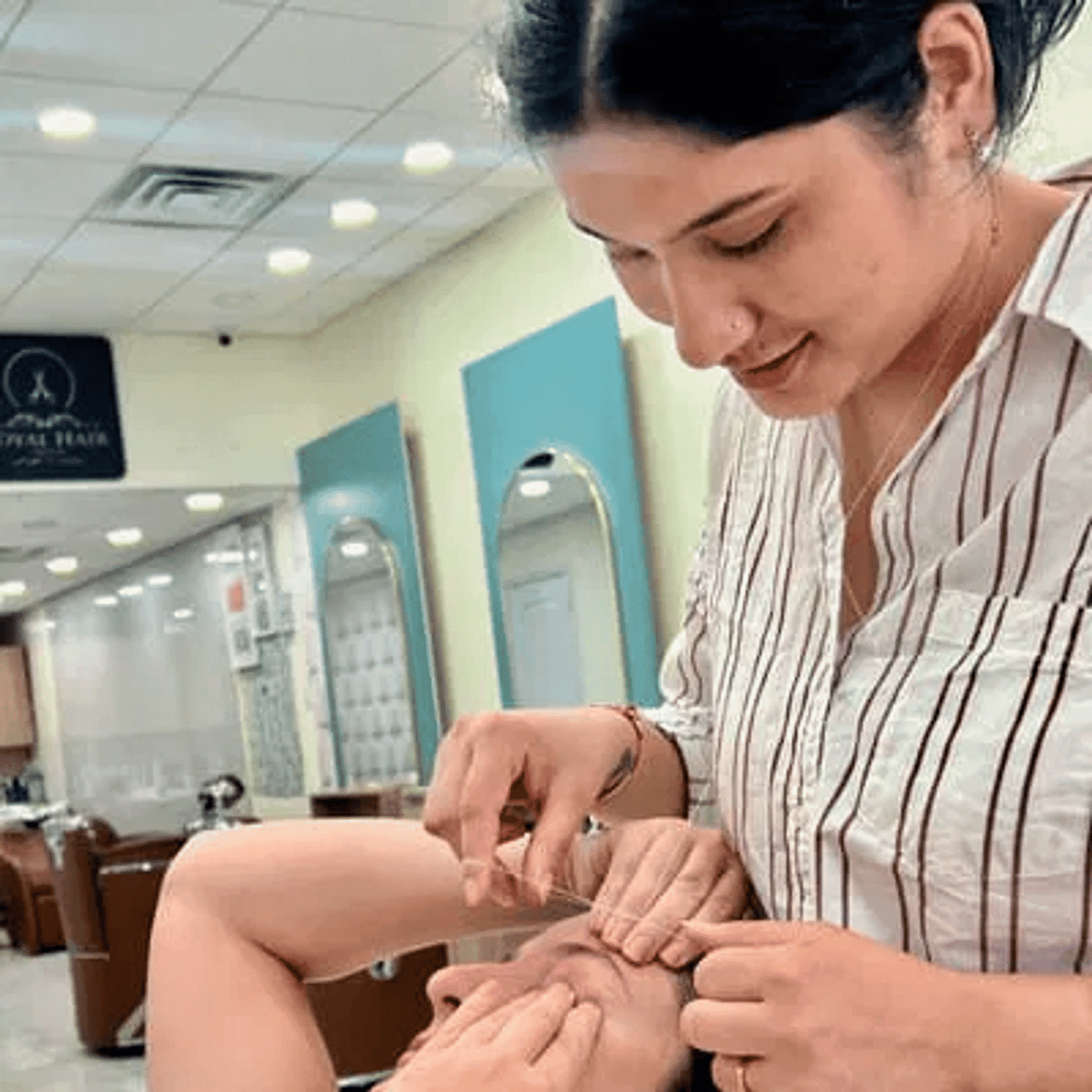 Portrait of Sami kc, a professional stylist at Royal Hair Salon, showcasing their expertise and style.